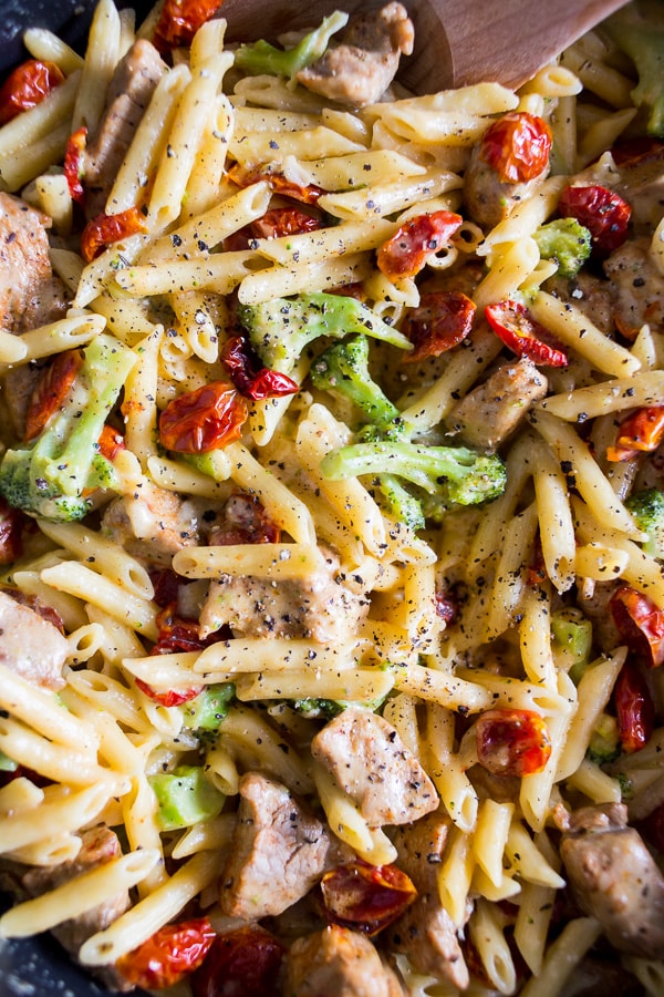 The one pot cheddar cajun pork pasta is packed full of broccoli, slow roasted cherry tomatoes, sharp cheddar cheese and LOTS of cajun spiced pork. You'll love how simple this dish is to make and the cleanup is a breeze since it's all made in the same pot! 