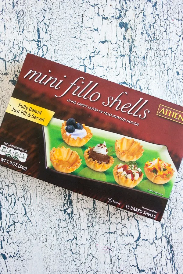 A box of mini phyllo shells on a table. 