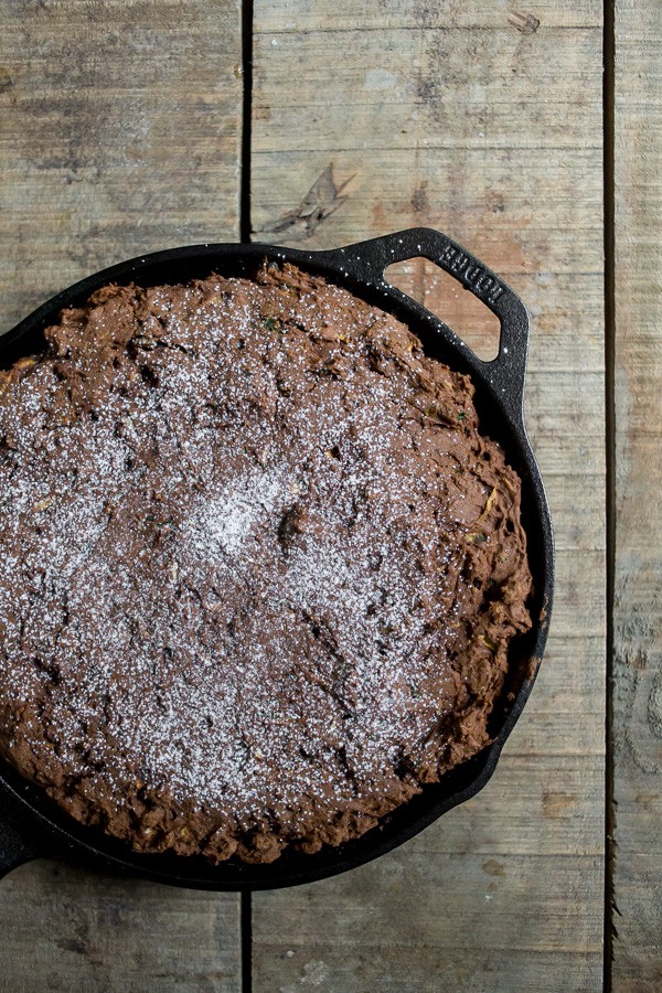 This chocolate zucchini date cake is lightly sweet and full of rich chocolate flavor. Plus it's a great use for all that overflowing garden zucchini. Dust lightly with powdered sugar or serve with a giant scoop of ice cream. The choice is yours! 