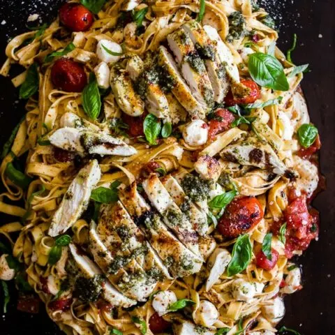 This pesto chicken Caprese pasta is packed full of flavor and packed full of pesto grilled chicken, grape tomatoes, fresh mozzarella and lots of basil. You'll love this fresh pasta not only because it's fresh but because it's easy and ready in just 30 minutes!
