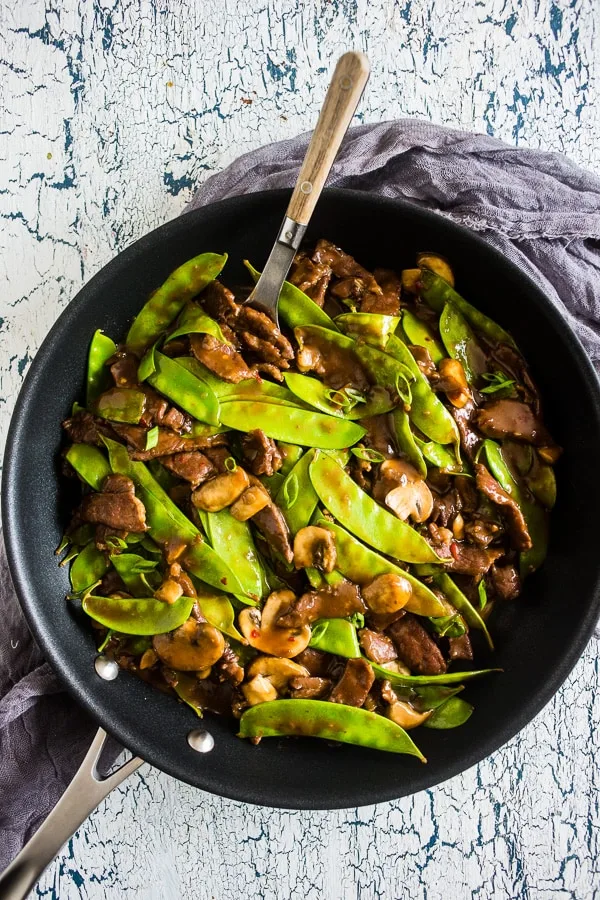 This 20 minute beef snow pea skillet is the perfect fast weeknight meal with a little takeout fake-out feel. Made all in one skillet and easily served alone or on top of rice. You'll love how easy and delicious this meal is to make!