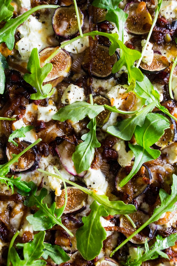 figs sitting on top of a Fig Caramelized Onion Pizza