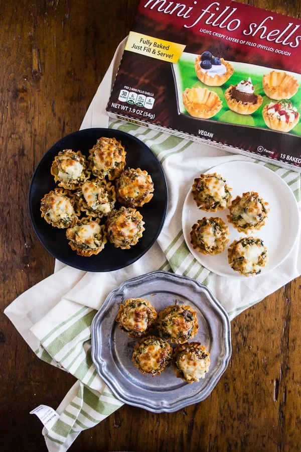 These sausage spinach mushroom phyllo bites are the perfect football snack! Just throw the ingredients into a skillet, warm it through, fill up the mini fillo shells and BOOM it's snack time! You'll LOVE these flavorful little bites. 