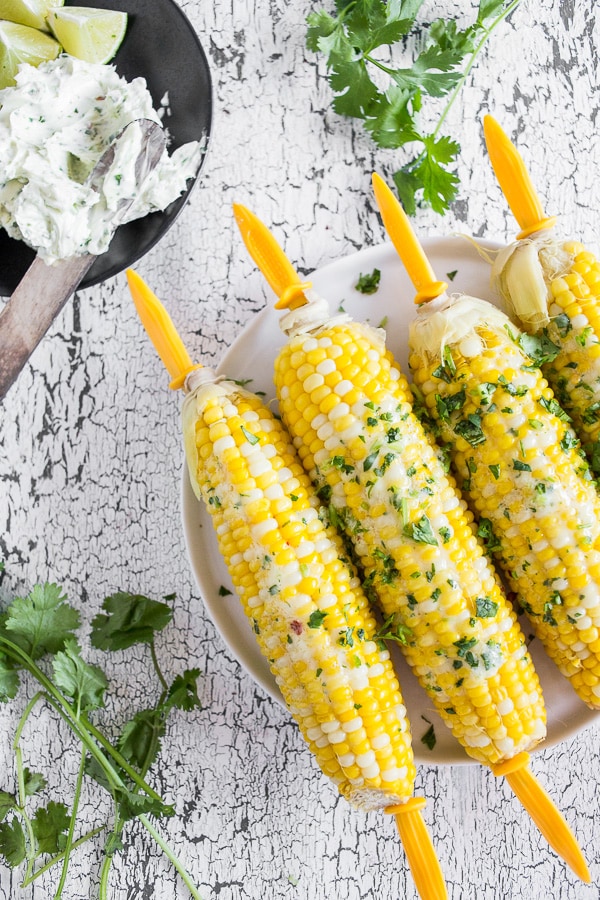Beer Steamed Corn on the Cob slathered with honey cilantro butter. 
