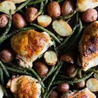 This sheet pan chicken and potato dinner with green beans is ready in under an hour and devoured in just minutes. You'll love how easy this dinner is to throw together and it will be sure to impress even the pickiest of eaters!