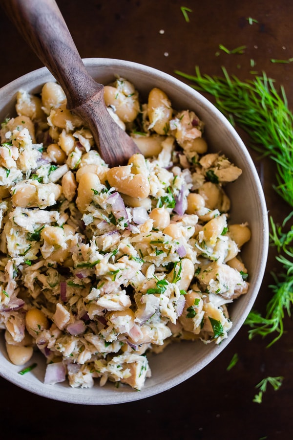 This tuna white bean herb salad is packed full of fresh lemon, herbs and cannellini beans. It's perfect served on toasted bread or while eating straight from the bowl. You'll love how light and easy this tuna salad is to make!