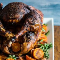 This adobo butter turkey is PACKED full of flavor and is the perfect turkey for your Thanksgiving day celebration. First, the turkey is marinated in adobo overnight and then rubbed down with flavor-packed adobo butter. Then it's roasted to perfection for a super juicy flavorful Thanksgiving turkey.