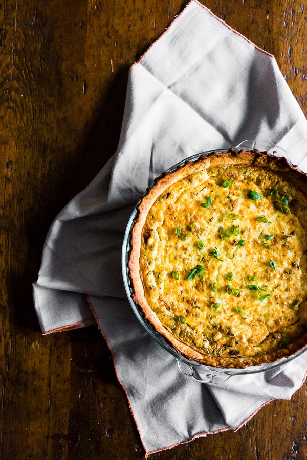 Bacon Onion Herb Quiche on a table.