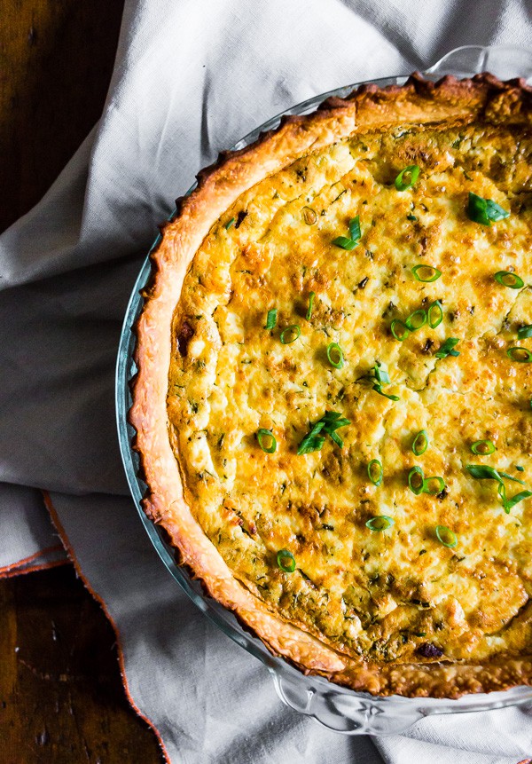 Bacon Onion Herb Quiche in a pie plate. 
