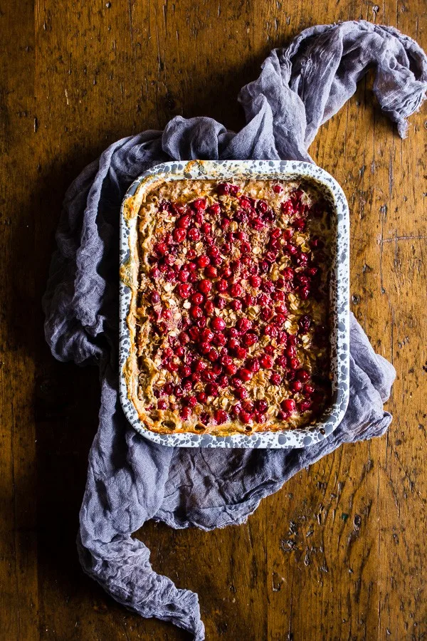 Baked Cranberry Oatmeal on a table with a napkin. 