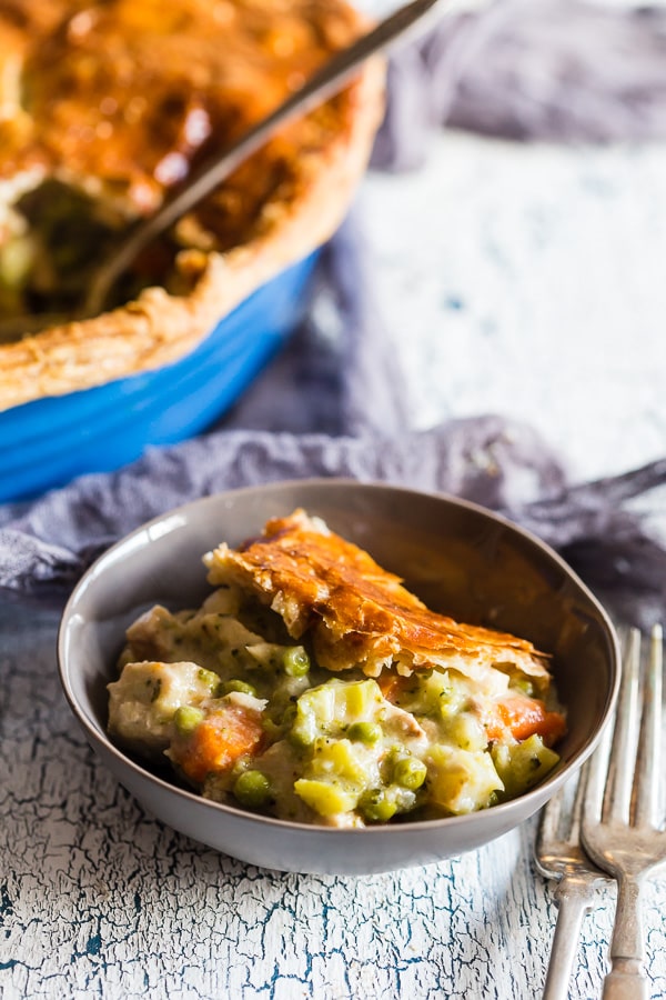 This puff pastry turkey pot pie is the perfect way to use up all those turkey holiday leftovers. Packed full of delicious vegetables, homemade gravy and topped with buttery flakey puff pastry topping. Plus it's hot and ready on your table in around 90 minutes! 