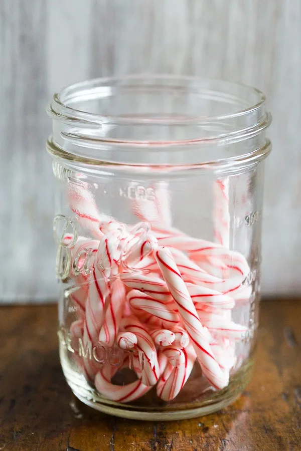 Candy canes in a glass jar. 