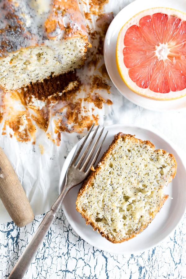 This Greek yogurt grapefruit poppy seed cake is jam packed full of flavor and super simple to make. Even the delicious sweet glaze on top is made from Greek yogurt! Serve plain or toast and drizzle with a little bit of honey for an extra sweet treat.