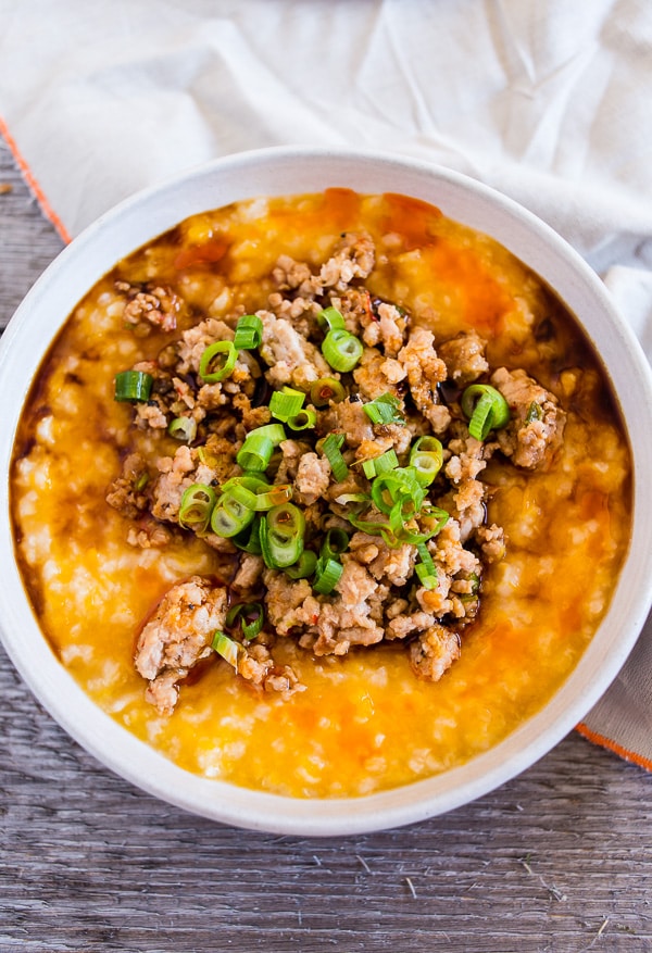 This pressure cooker butternut squash congee is topped with ground pork flavored with ginger, lemongrass, garlic, soy sauce and hot chili oil. This dish is 100% comfort food and can be enjoyed for breakfast, lunch or dinner. You'll love that it's ready in just 30 minutes by using your pressure cooker or Instant Pot.