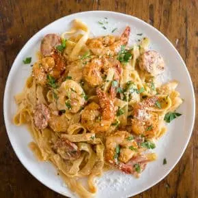 This Cajun shrimp fettuccine alfredo is packed full of flavor with a little Cajun twist. It's perfect for busy weeknights and you'll say goodbye to jarred sauces when you see how easy it is to make your own! Plus the little punch of andouille sausage really brings that Cajun flavor.