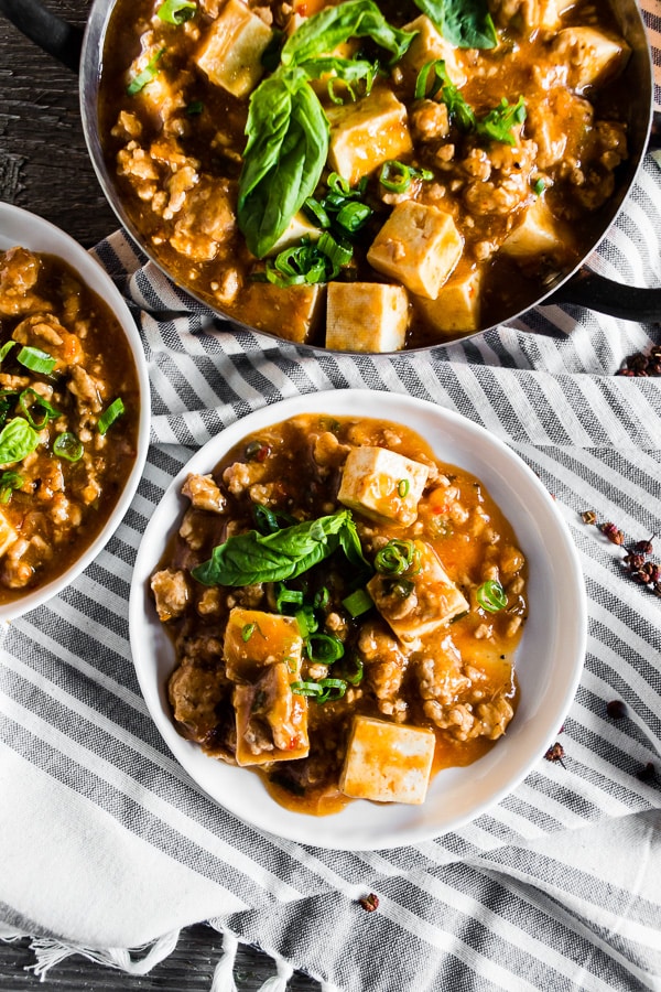 This ground pork mapo tofu is a straight up Asian comfort food. Packed full of ground pork, firm tofu, ginger, green onions, hoisin sauce and garlic chile sauce. This dish is hearty and best served over rice or just straight from the pot! Plus it's ready in just 30 minutes! 