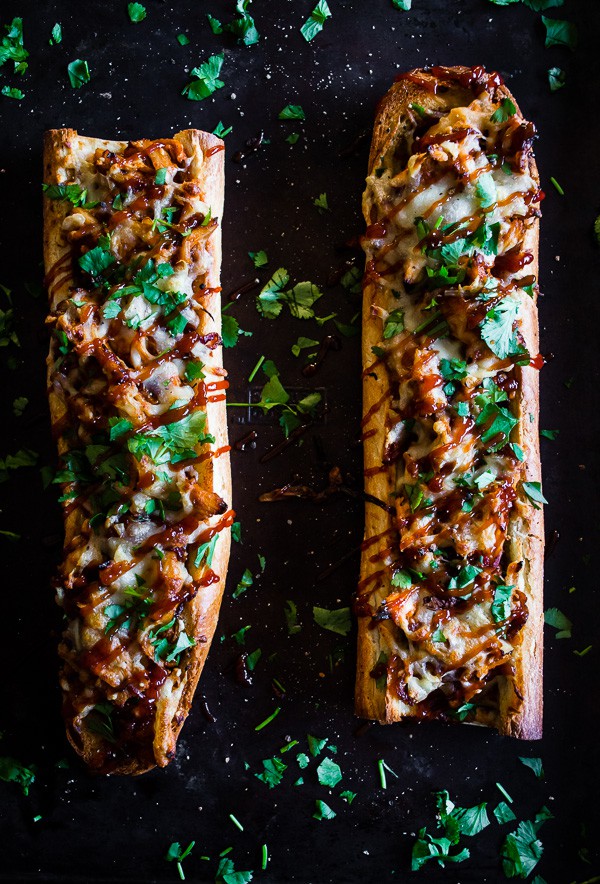 This smoked mozzarella bbq chicken french bread pizza is packed full of flavor and a breeze to make. I made it even easier by using rotisserie chicken so it's ready in just 30 minutes! You're going to love this flavorful dish that's perfect for football parties, weeknight dinner or a delicious snack. 