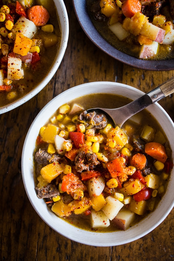 This Chilean carbonada soup is a classic dish found in Chile. It's pure comfort in the form of beef, corn, potatoes, pumpkin and carrots. It's easy to make and feels like comfort in a bowl. Plus, it's perfect for cool spring nights.