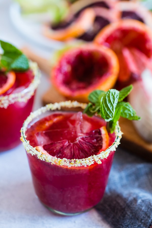 This blood orange ginger margarita is the perfect cocktail for your weekend parties! This baby uses blood oranges and pairs it with spicy ginger, lime juice, tequila and agave stevia blend syrup. You're going to love how easy it is to make these fresh and seasonal cocktails!