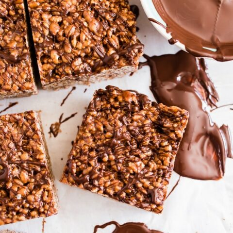 These peanut butter Nutella Rice Krispie treats are extra large, extra marshmallowy and crazy delicious! You're going to love how easy these treats are to make and they are ready in just 20 minutes! Plus to top them off I drizzled them with dark chocolate.