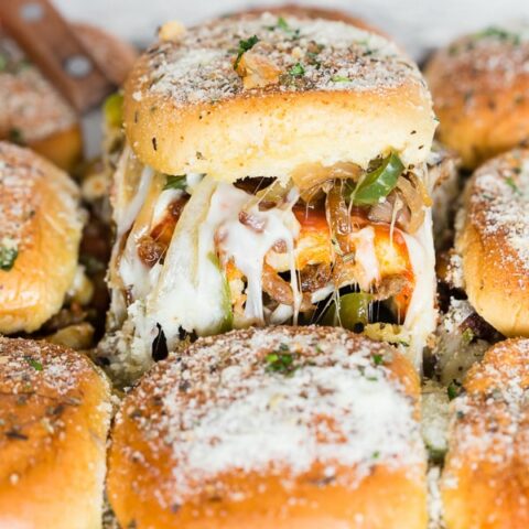 These baked supreme pizza sliders are the new baked sandwiches of your dreams. They taste just like loaded supreme pizza made with marinara sauce, spicy Italian sausage, pepperoni, mushrooms, green peppers, onions and lots of mozzarella cheese. You'll love how easy these baked sliders are to make!
