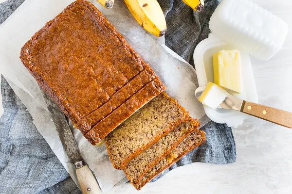 This coconut rum lime glazed banana bread is perfectly moist and glazed with the most delicious brown sugar coconut rum lime mixture. It's perfectly sweet and the perfect way to use up all those browning bananas. It's time to get into the kitchen and start baking!