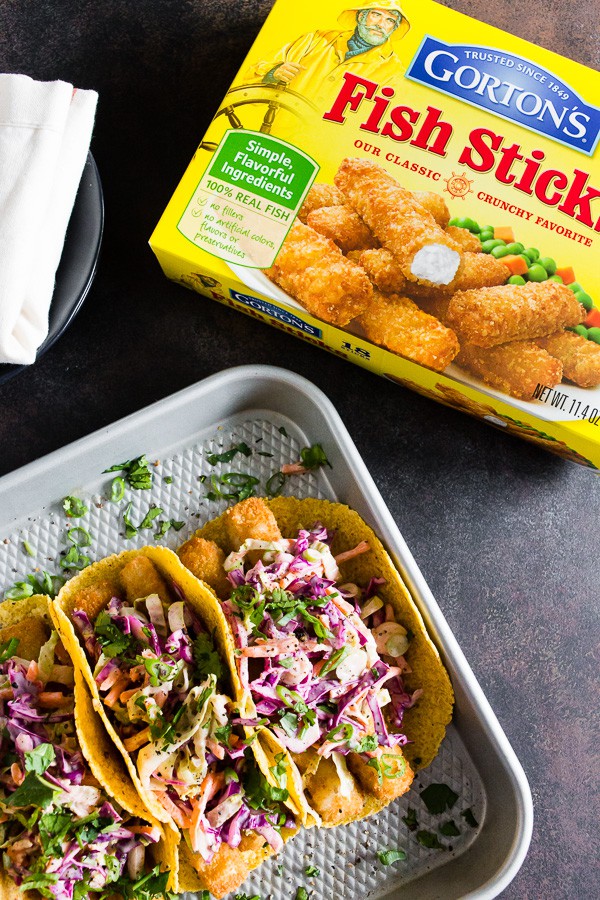 These easy fish tacos with citrus Greek yogurt slaw are the perfect busy weeknight meal. Super crispy fish topped with a crazy easy cabbage slaw made with Greek yogurt and lime juice. You'll love how easy these tacos come together! 