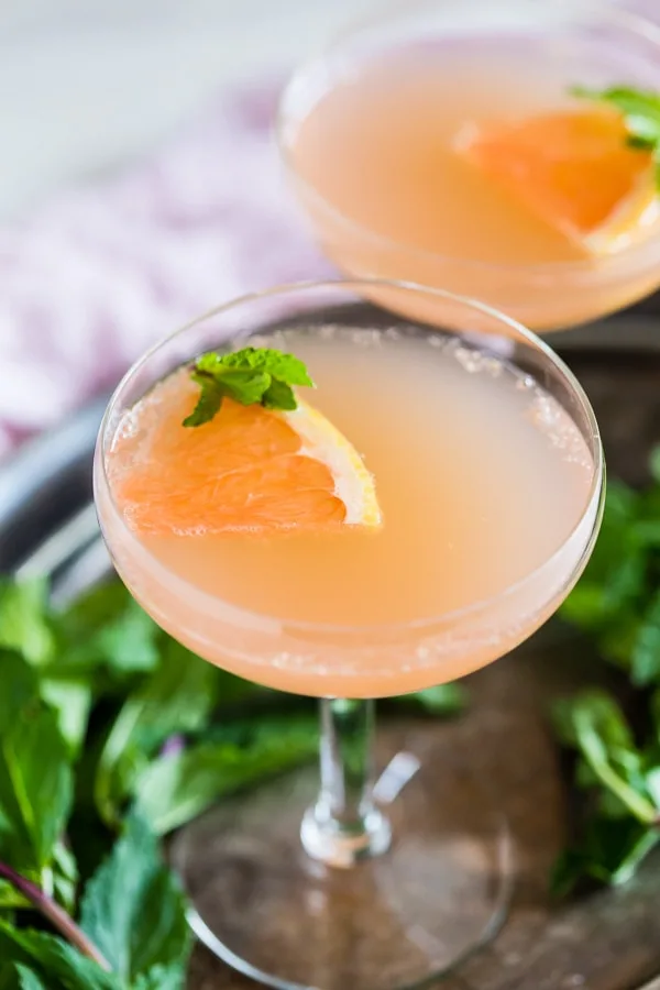 This grapefruit Campari rose water cocktail is your new summertime jam! Light and refreshing with soft subtle floral notes. You'll love all the flavor packed in this cocktail!