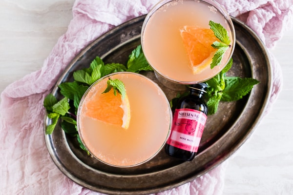 This grapefruit Campari rose water cocktail is your new summertime jam! Light and refreshing with soft subtle floral notes. You'll love all the flavor packed in this cocktail! 