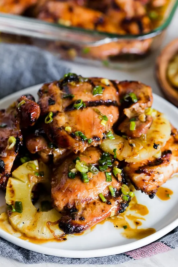 grilled sweet soy marinated chicken thighs on a serving platter. 