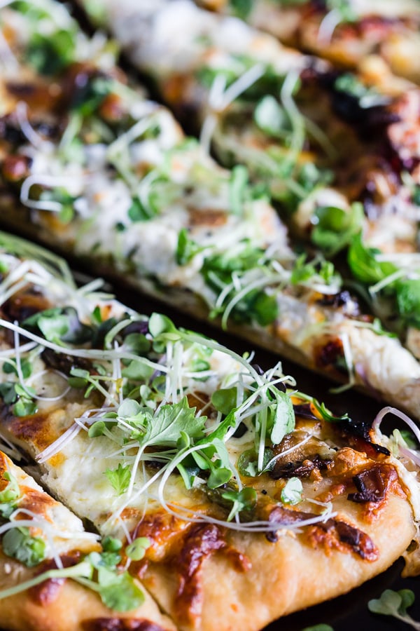 Asparagus Mushroom Burrata Pizza topped with microgreens. 