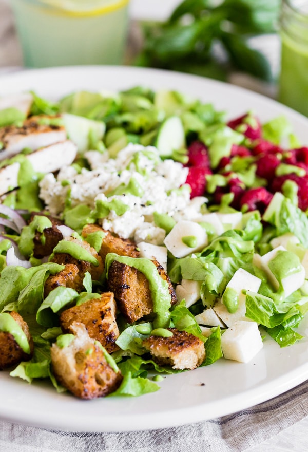 Greek Yogurt Green Goddess Dressing on top of a green salad. 