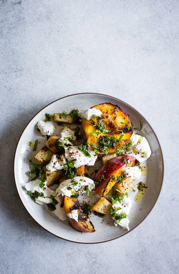 overhead look at a plate topped with grilled peach burrata salad.