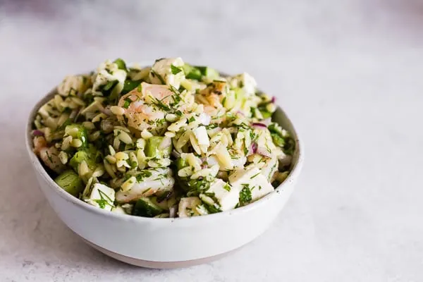 Herbed Shrimp Orzo Salad in a white bowl. 
