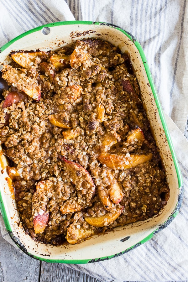 ginger peach crisp in a small metal dish