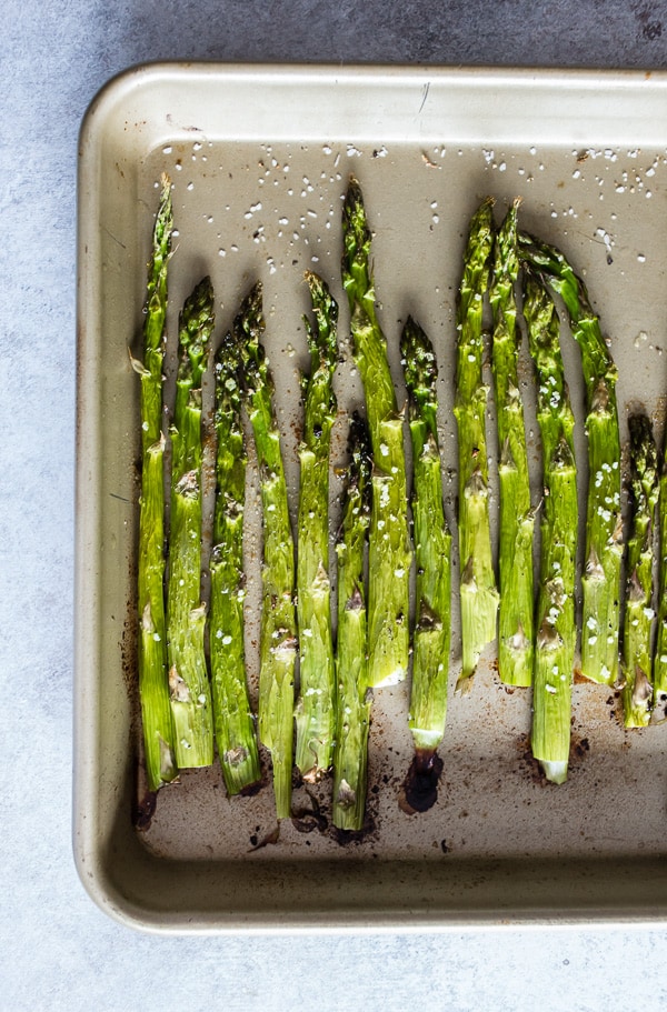 This roasted asparagus is perfectly seasoned and the perfect side dish. Made with just 4 ingredients and ready in just 15 minutes. You'll love how easy it is to go from boring asparagus to CRAZY GOOD asparagus. 