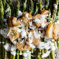 This roasted asparagus Caesar salad is packed full of flavor and a great twist to classic roast asparagus. Plus you'll love the homemade Greek yogurt caesar dressing!