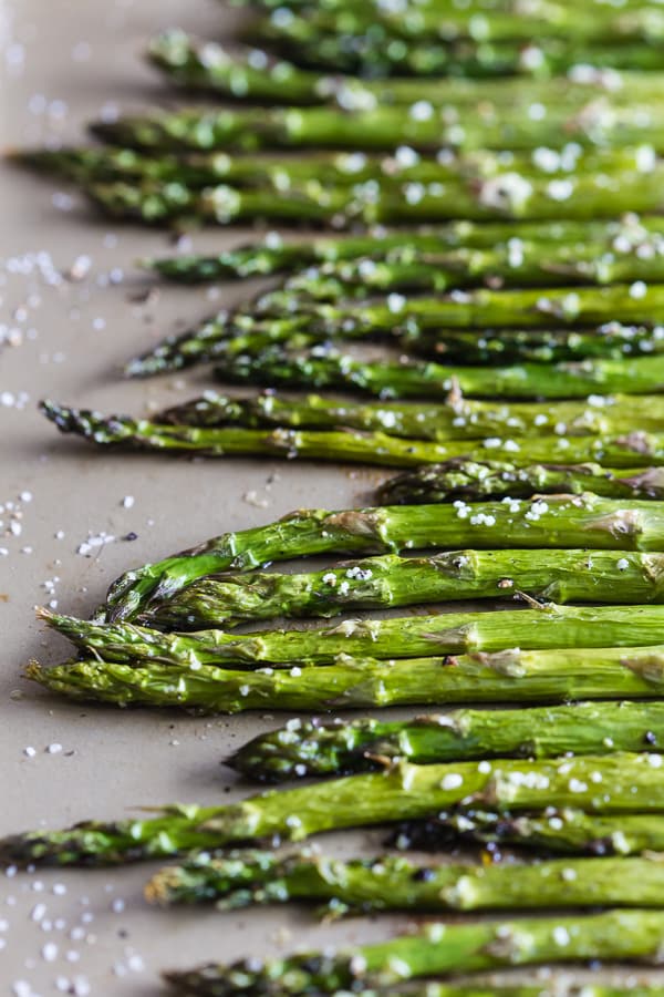 This roasted asparagus is perfectly seasoned and the perfect side dish. Made with just 4 ingredients and ready in just 15 minutes. You'll love how easy it is to go from boring asparagus to CRAZY GOOD asparagus.
