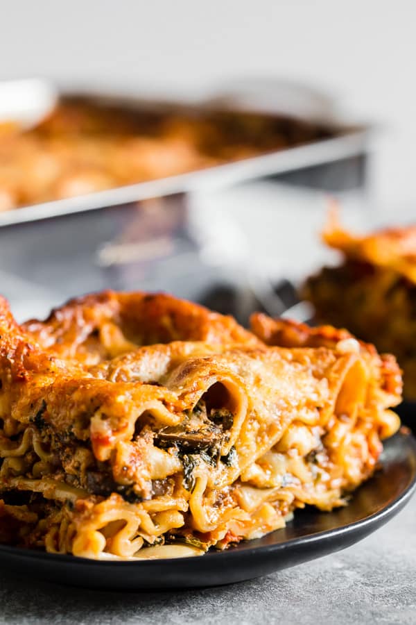 This Italian sausage and mushroom lasagna is PACKED with spicy Italian sausage, sliced baby bella mushrooms, baby spinach, lots of cheese and rich tomato sauce. It's super easy to throw together and bakes up like a dream. 