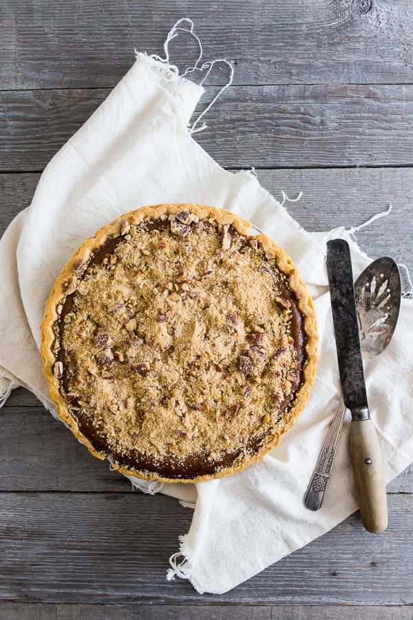 This streusel topped apple butter pumpkin pie is the perfect addition to your holiday dessert spread. It's the perfect twist to traditional pumpkin pie and the crumbly streusel topping is packed full of spice.