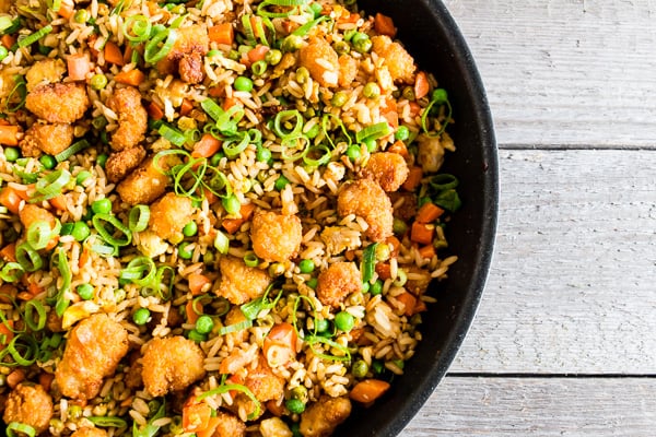 This crispy shrimp fried rice is the perfect busy weeknight meal. Crispy baked shrimp mixed together with a homemade vegetable and egg filled fried rice. Plus it's ready in just 20 minutes! How easy is that?