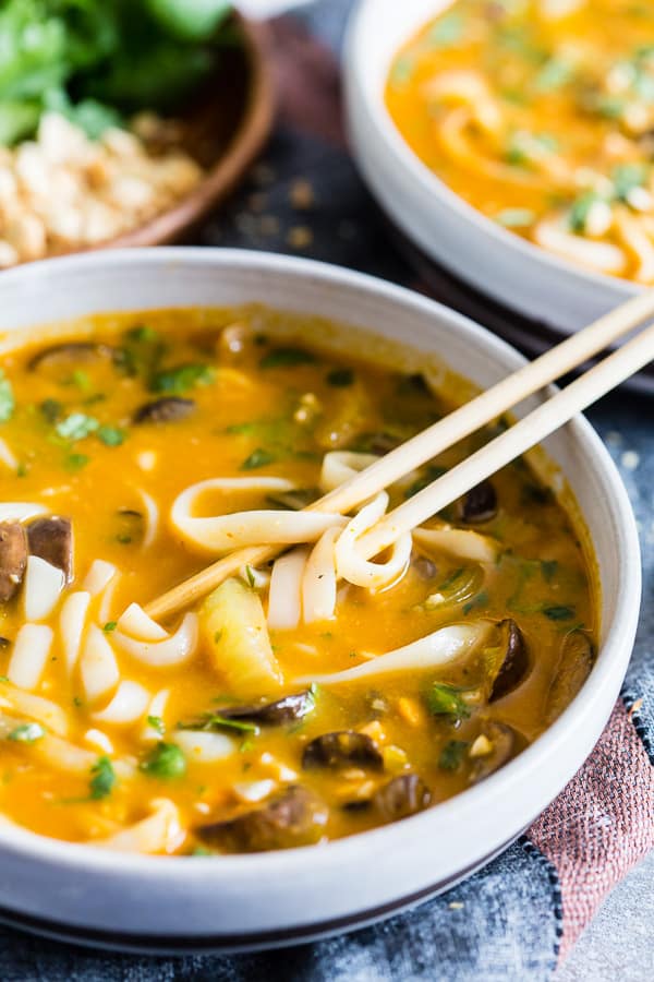 This vegan red curry pumpkin noodle soup is the perfect way to celebrate fall. Creamy pumpkin mixed with vegetable broth, coconut milk, mushrooms and baby bok choy all mixed together with Thai flavors and noodles for slurping.