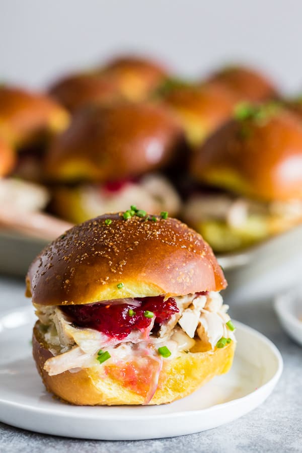 Baked Cranberry Cheddar Turkey Sandwiches on a plate. 