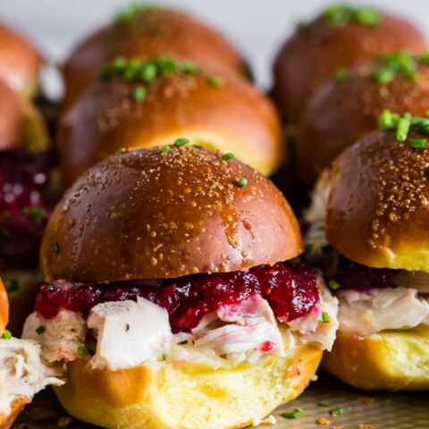 These baked cranberry cheddar turkey sandwiches are the perfect use for your leftover Thanksgiving turkey and cranberry sauce. What's not to love about delicious potato rolls topped with Thanksgiving leftovers? 