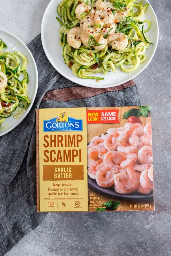 These garlic shrimp pesto zoodles are the perfect quick and easy weeknight meal. Spiralized zucchini tossed in pesto and topped with creamy garlic butter shrimp. You're going to love this recipe! 