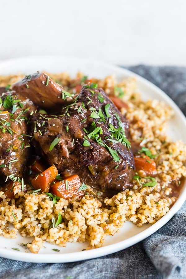 These instant pot red wine rosemary short ribs are the perfect use of your electric pressure cooker. They turn out perfectly tender and are packed full of red wine and rosemary flavor. They are even better when served with ancient grains and drizzled with red wine gravy. 
