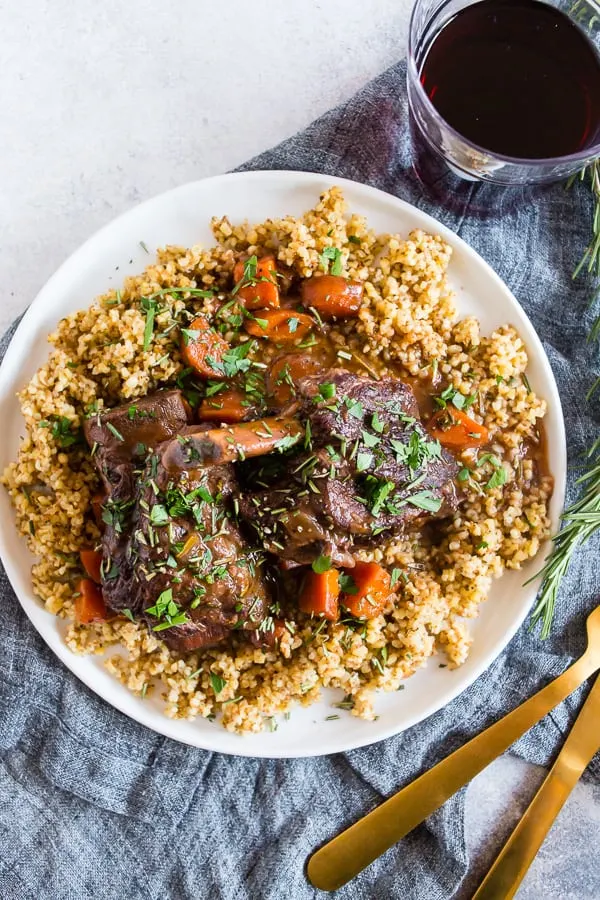 Instant Pot Short Ribs with Red Wine on a plate served with a fork. 