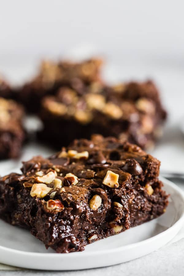 These hazelnut buckwheat brownies are packed full of dark chocolate, semisweet chocolate chips, and chopped hazelnuts. They are super fudgy and made with a delicious mix of buckwheat and white whole wheat flour. Trust me, you'll love these brownies! 
