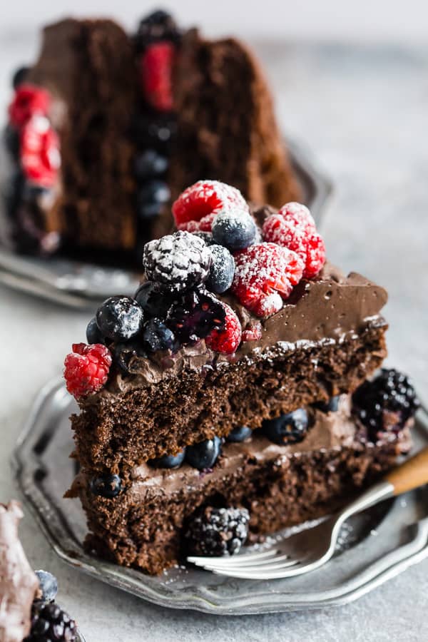 Chocolate cake topped with berries and Espresso Dark Chocolate Mascarpone Frosting.