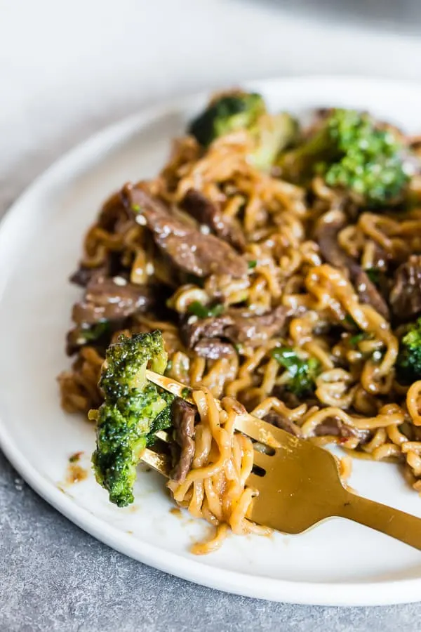 Beef and Broccoli Ramen Noodles on a plate with a fork. 